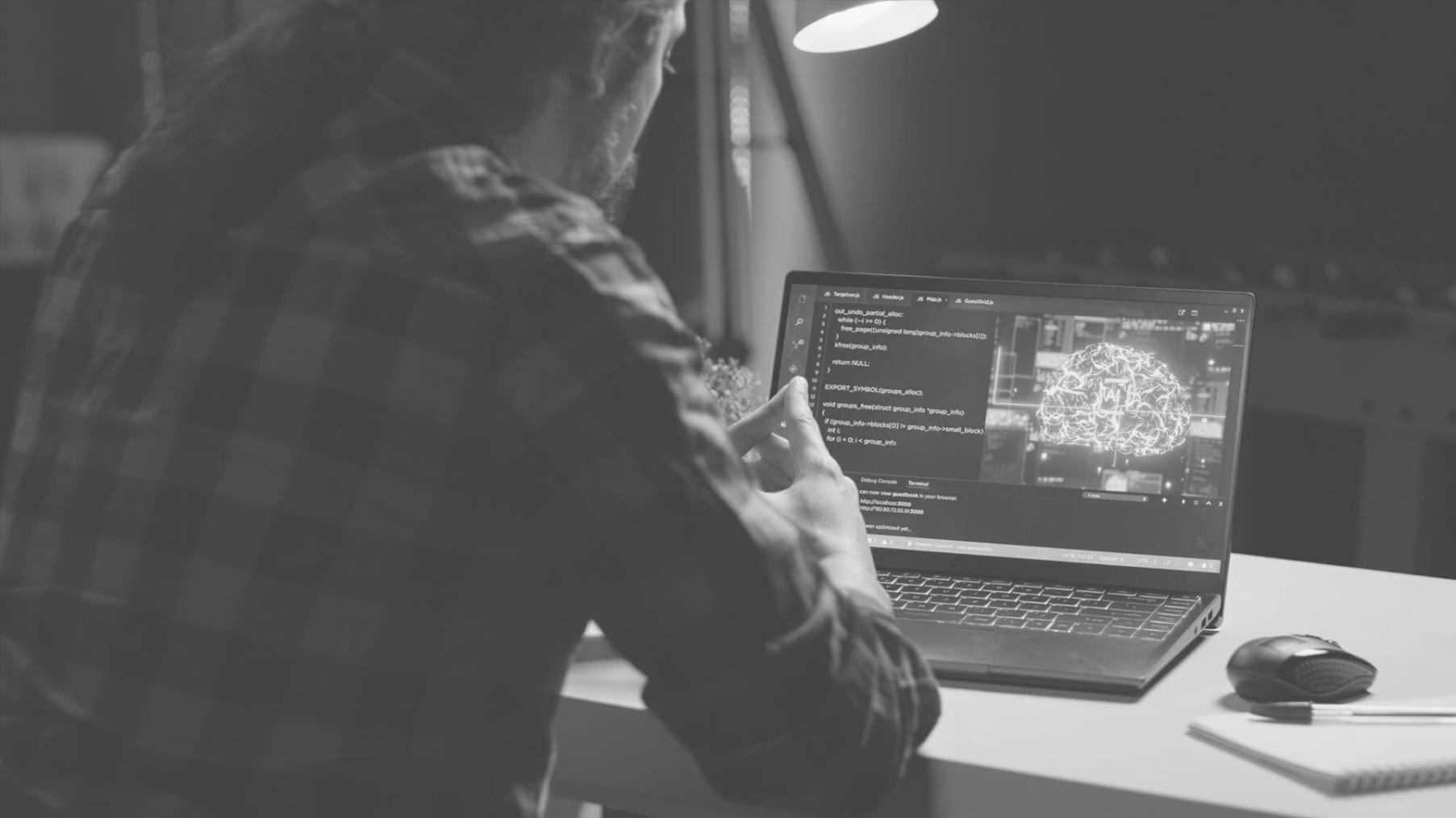 Professional game development studio environment with multiple monitors showing 3D asset integration workflows